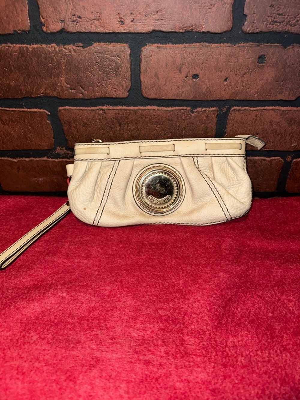 Cream Leather Wristlet Clutch with Gold Medallion Accent